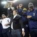 Michigan senior offensive lineman David Molk holds the Sugar Bowl trophy up as the football team is honored for their bowl win during a timeout in the first quarter against Northwestern at Crisler Center on Wedensday. Melanie Maxwell I AnnArbor.com